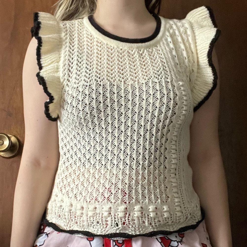 Hem & Thread knit sleeveless sweater.